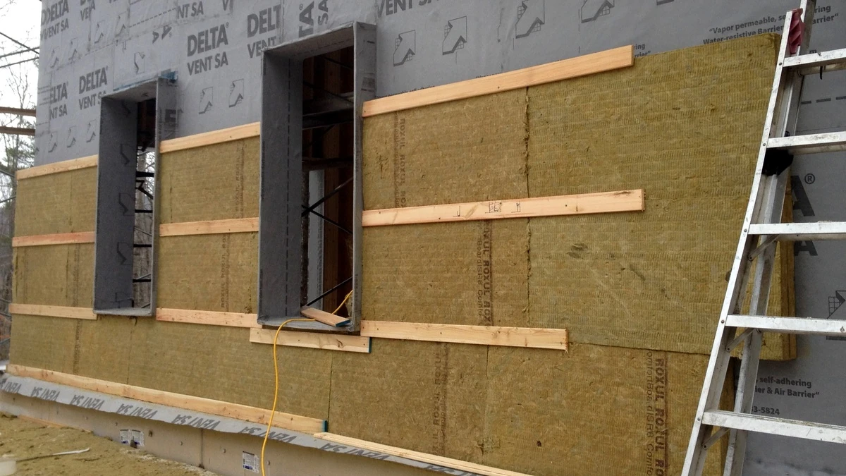 Exterior continuous wall insulation boards installed on building sheathing in Vancouver BC